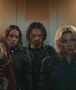 Yelena Belova/White Widow (Florence Pugh) reunites with father figure Alexei Shostakov/Red Guardian, then collides with U.S. Agent/John Walker (Wyatt Russell), Ghost/Ava Starr (Hannah John-Kamen), and the Winter Soldier/Bucky Barnes (Sebastian Stan) stand in an elevator in a still from Marvel’s Thunderbolts*
