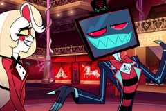 Charlie Morningstar, a human-like demon with long blonde hair, grins uncomfortably as Vox, a demon with a television for a head, smiles toothily and shrugs at her in season 2 of Hazbin Hotel