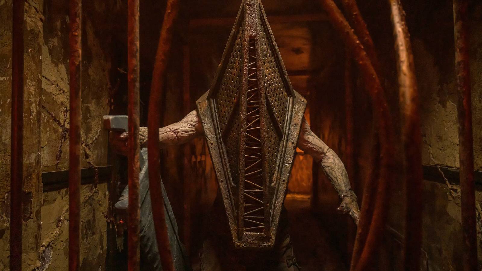 An upper-body shot of Pyramid Head holding his giant slab blade in his right hand from the movie Return to Silent Hill